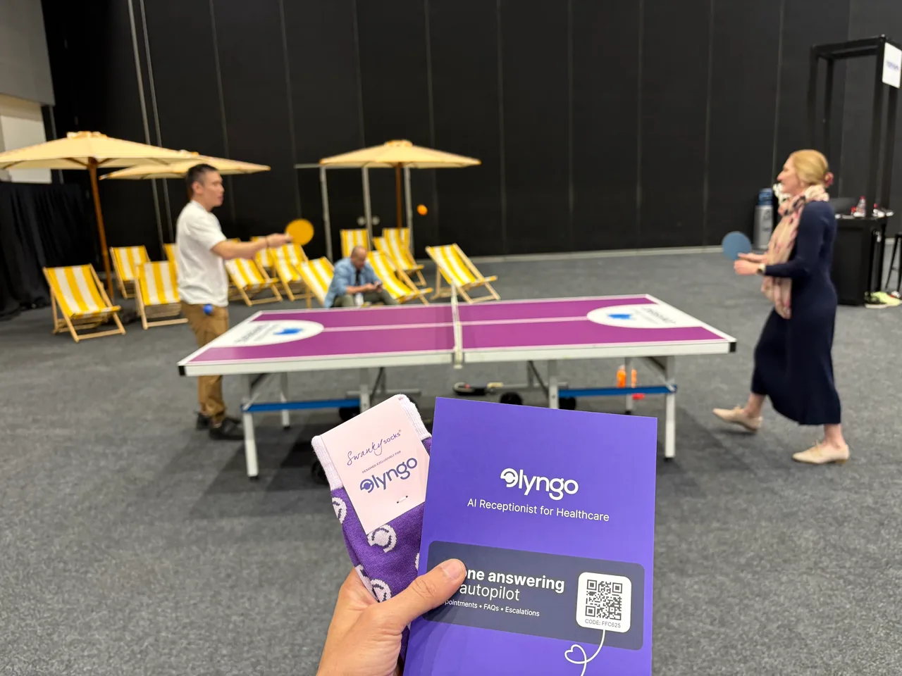 Lyngo team playing ping pong at the Australian Podiatry Conference 2025